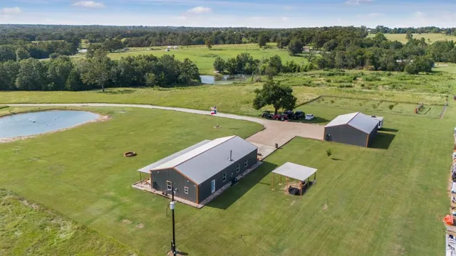 an aerial view of residential houses with outdoor space