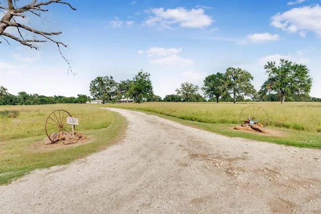 a view of a lake in middle of the road