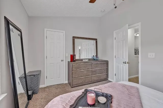 a room with a bed and a mirror