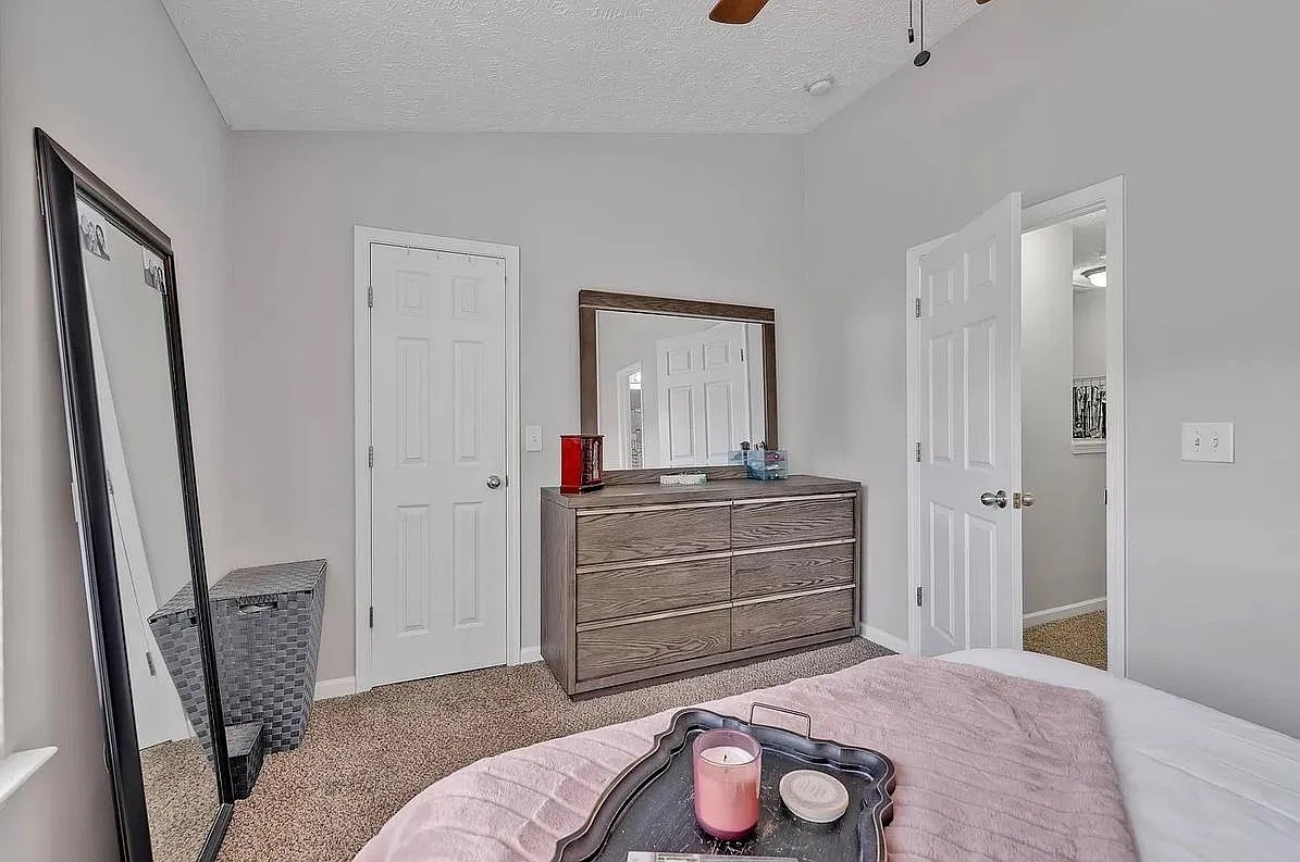 1504 Sprucedale Drive Antioch, TN 37013 - Photo 19 of 30 a room with a bed and a mirror