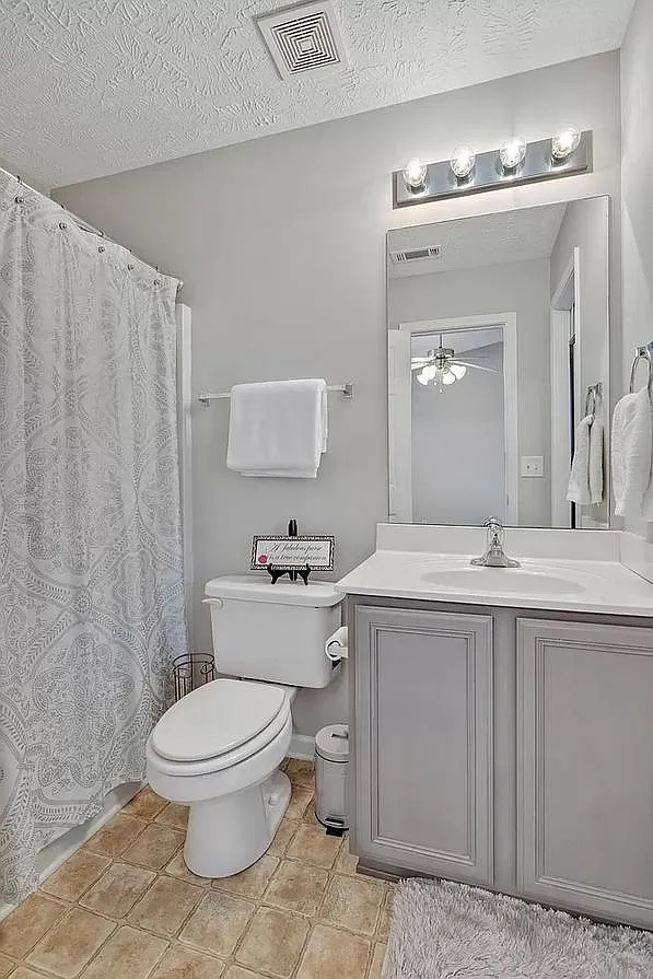 1504 Sprucedale Drive Antioch, TN 37013 - Photo 21 of 30 a bathroom with a toilet a sink and mirror