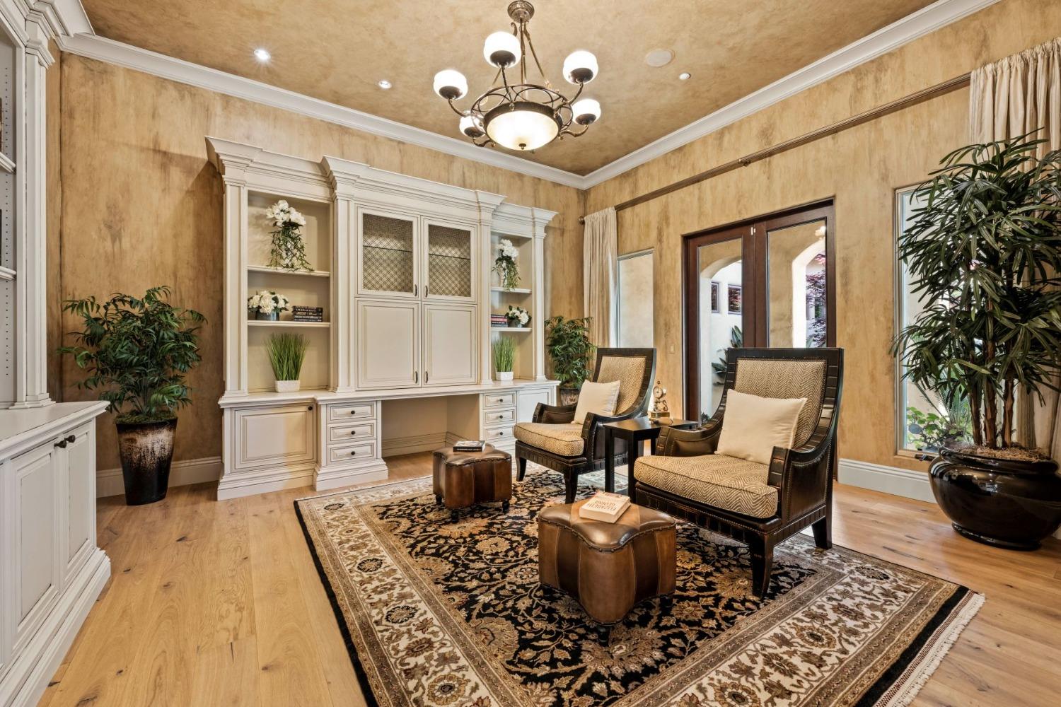 5687 Ridge Park Drive Loomis, CA 95650 - Photo 11 of 79 a living room with furniture a chandelier and a rug