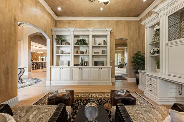 a large white kitchen with a sink and dishwasher