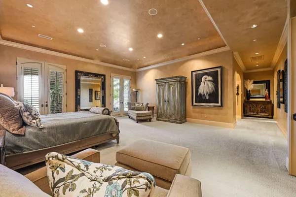 a view of a swimming pool and lounge chairs