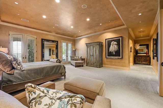 a view of a swimming pool and lounge chairs