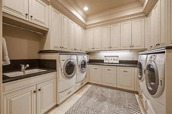a bathroom with a double vanity sink toilet mirror and shower
