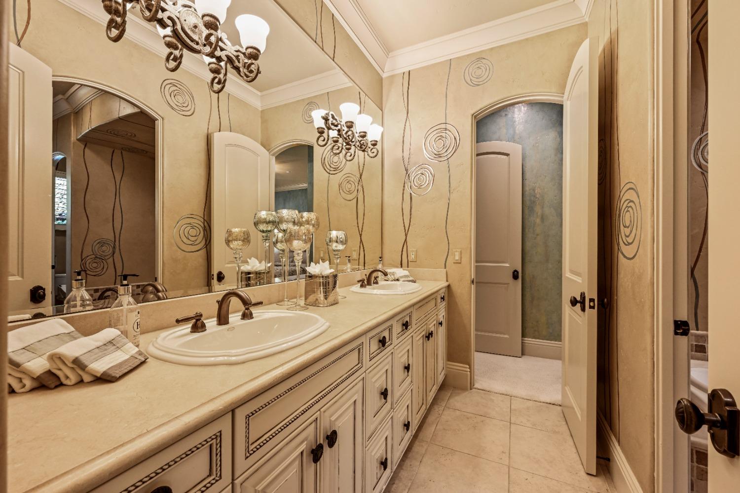 5687 Ridge Park Drive Loomis, CA 95650 - Photo 27 of 79 a bathroom with a double vanity sink and a mirror