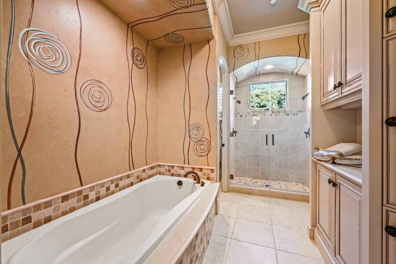 5687 Ridge Park Drive Loomis, CA 95650 - Photo 28 of 79 a bathroom with a bathtub and a shower