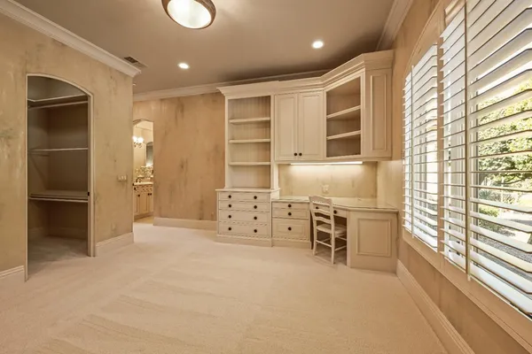 a front view of a house with a yard and a garage