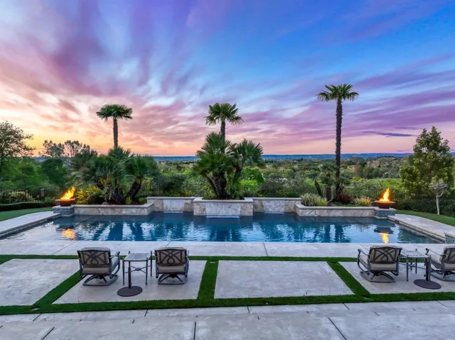 a kitchen with a table and chairs in it