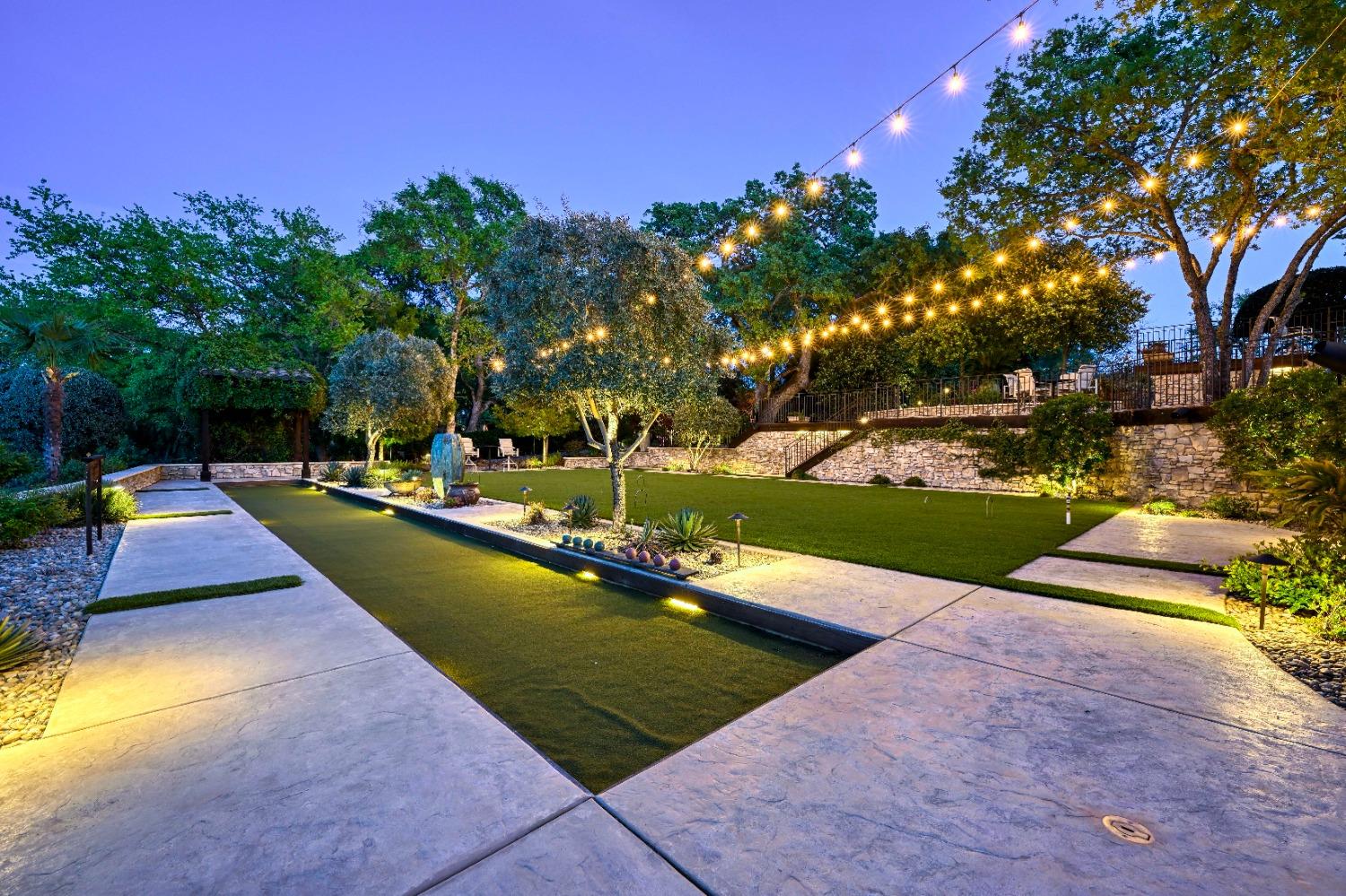 5687 Ridge Park Drive Loomis, CA 95650 - Photo 36 of 79 a view of a swimming pool with some potted plants and large trees