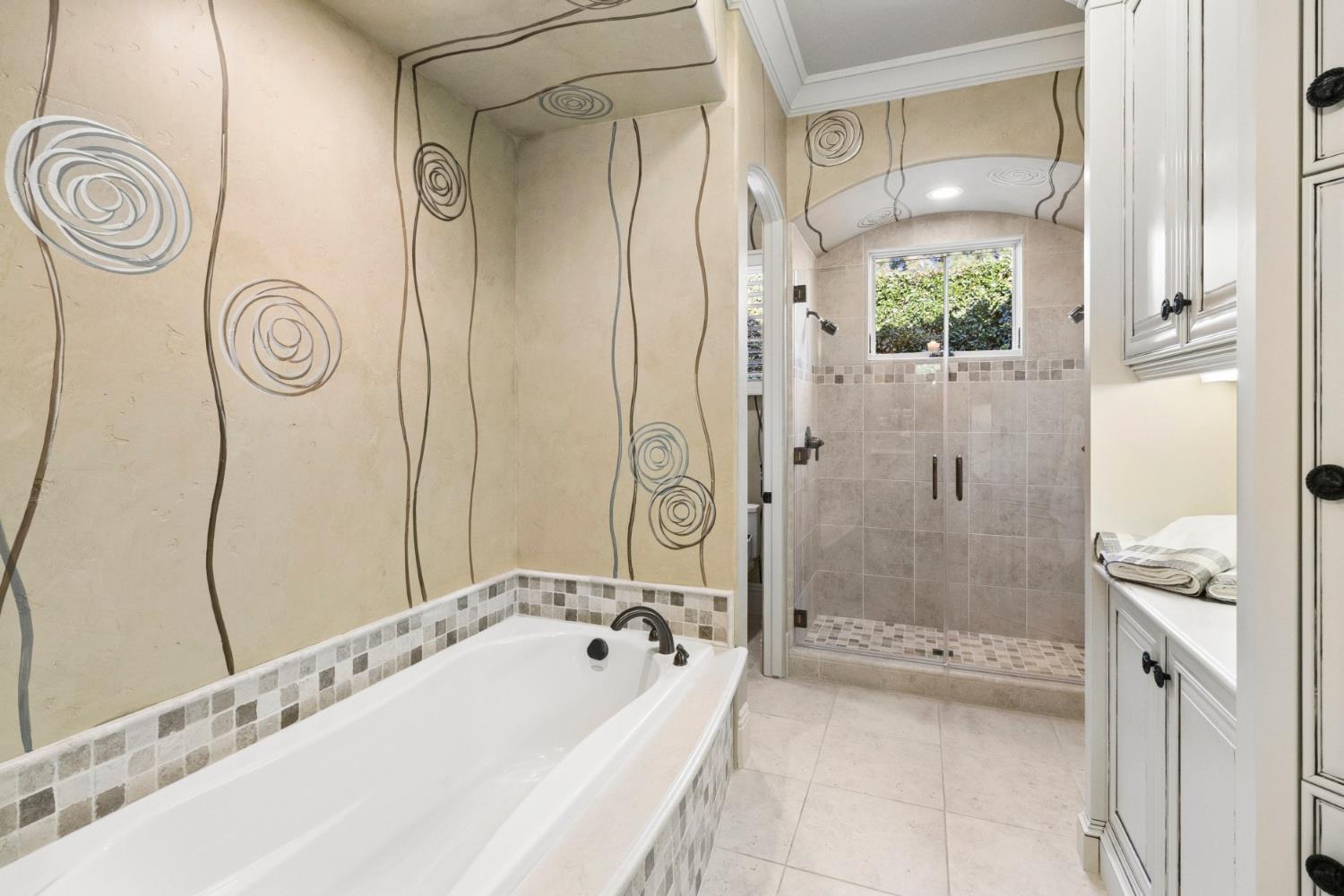 5687 Ridge Park Drive Loomis, CA 95650 - Photo 37 of 97 a bathroom with a granite countertop bathtub shower and a sink