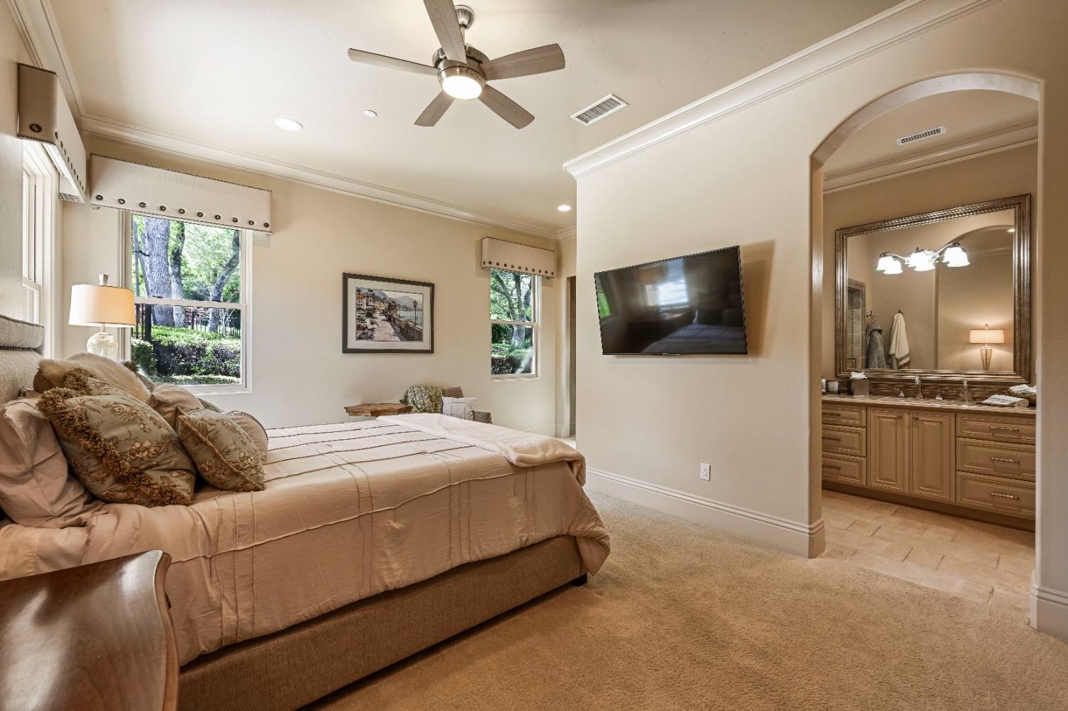 5687 Ridge Park Drive Loomis, CA 95650 - Photo 37 of 79 a living room with a bed furniture and a flat screen tv