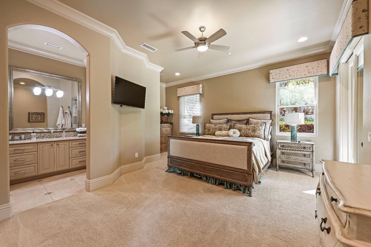 5687 Ridge Park Drive Loomis, CA 95650 - Photo 38 of 79 a bedroom with furniture and a flat screen tv