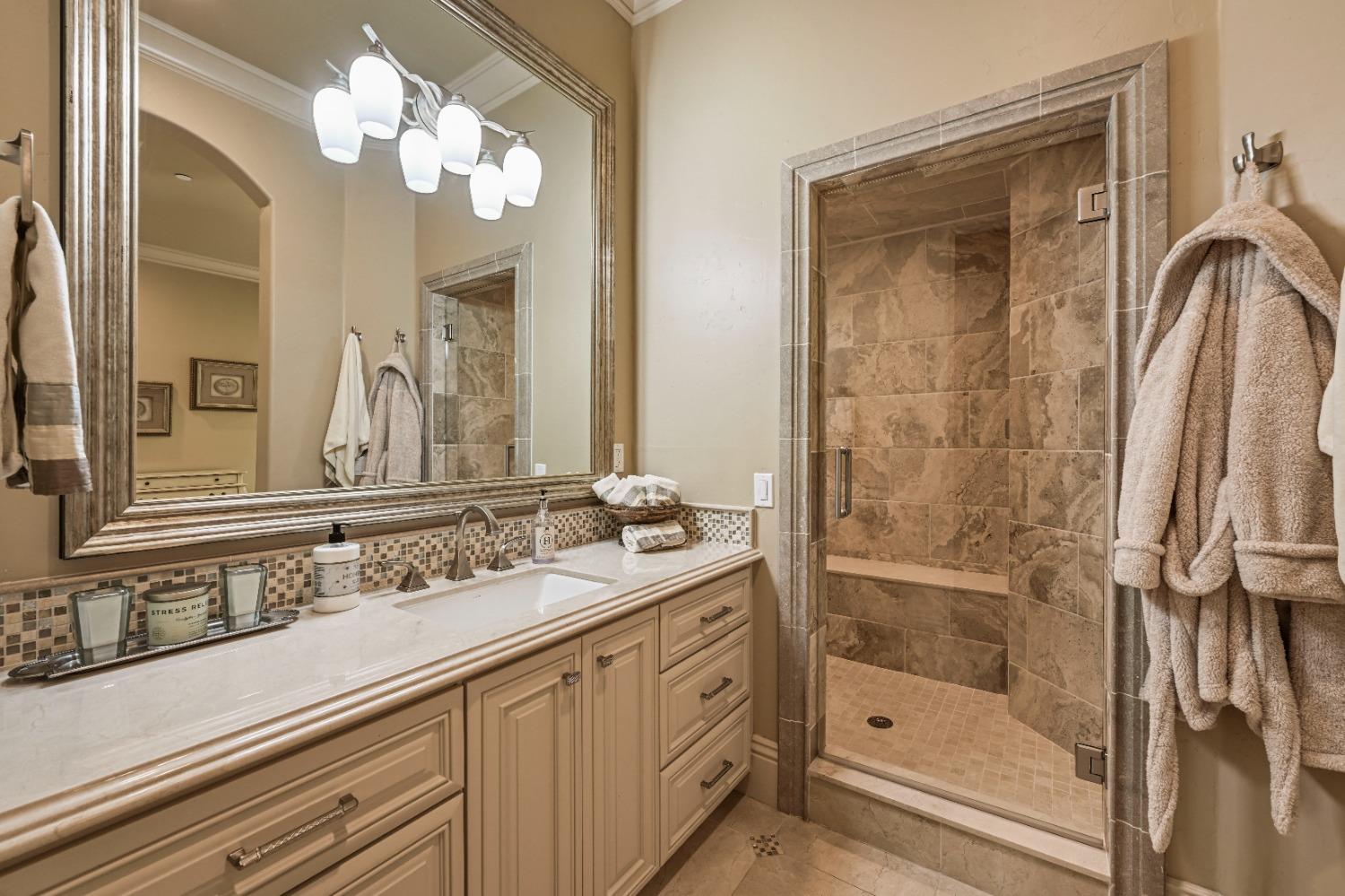 5687 Ridge Park Drive Loomis, CA 95650 - Photo 39 of 79 a bathroom with a double vanity sink mirror and shower