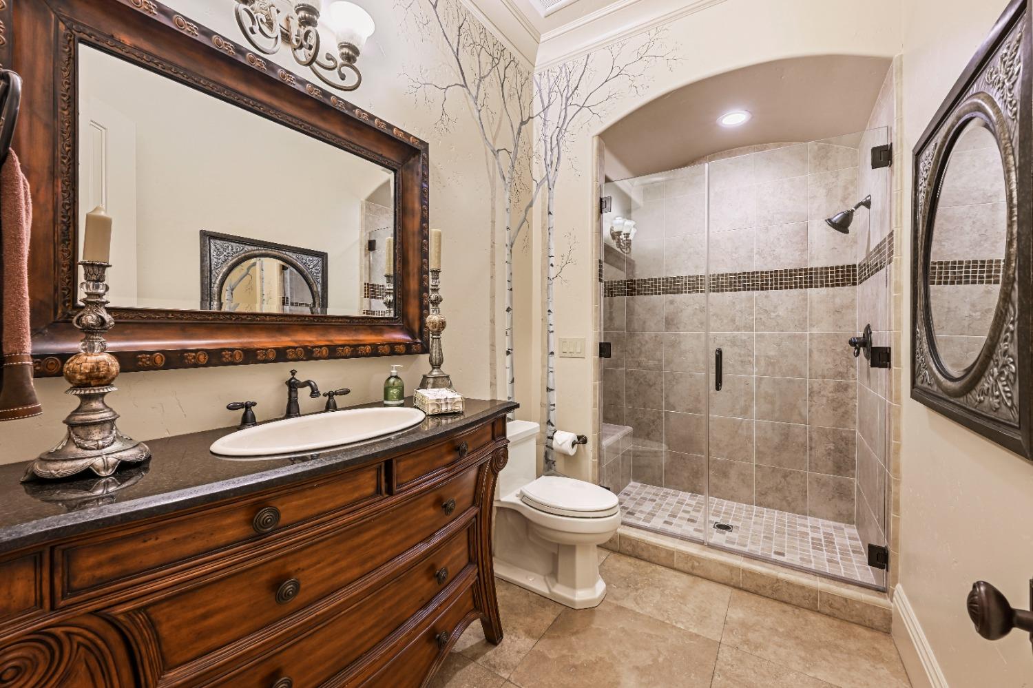 5687 Ridge Park Drive Loomis, CA 95650 - Photo 40 of 79 a bathroom with a double vanity sink toilet mirror and shower