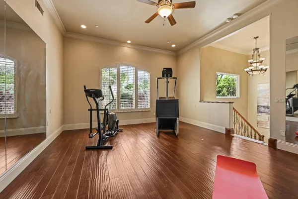 a view of a patio with dining table and chairs with wooden floor