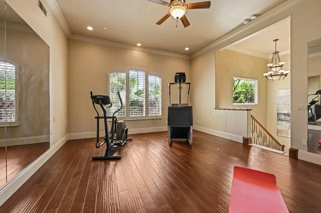 a view of a patio with dining table and chairs with wooden floor