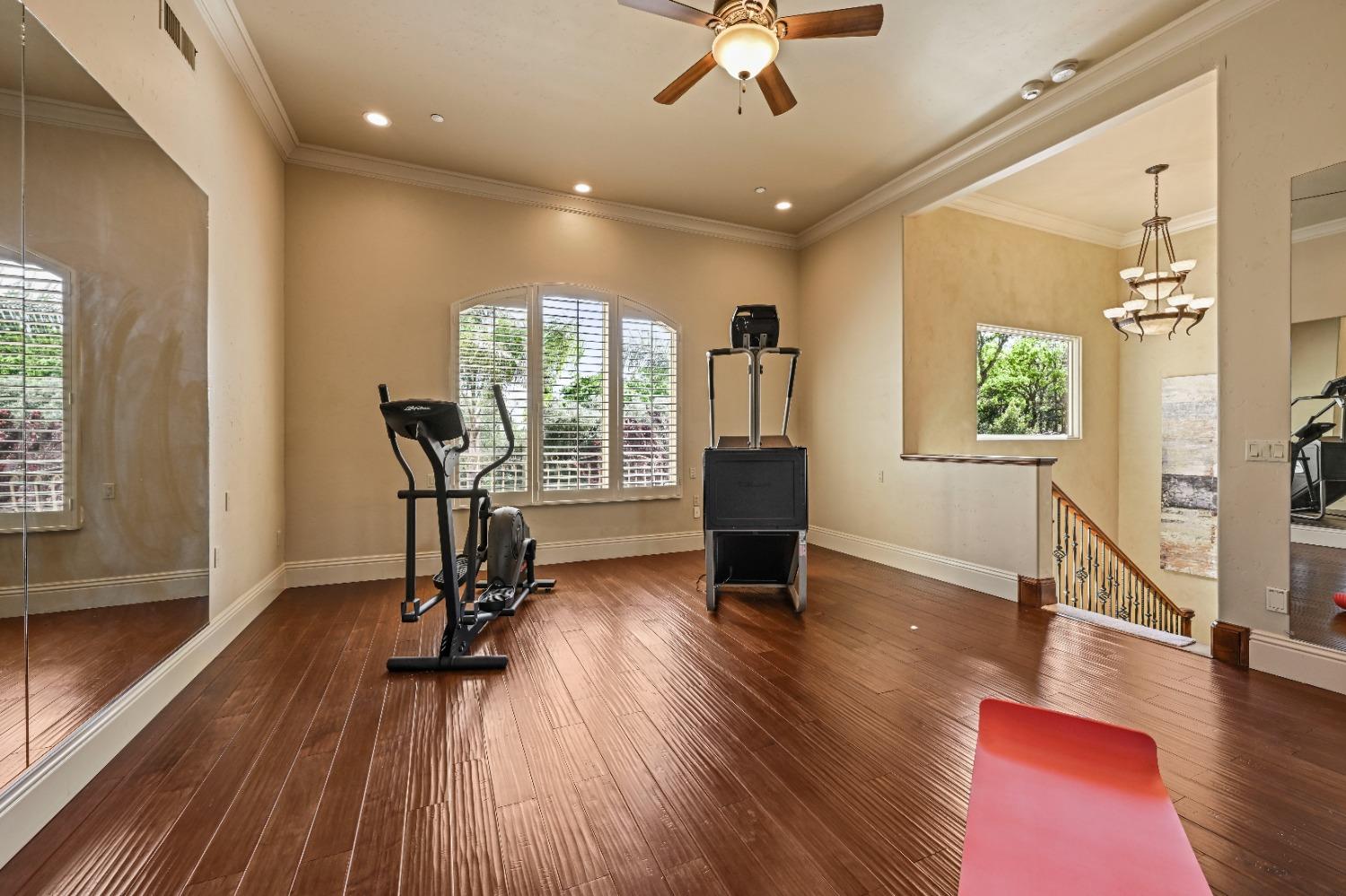 5687 Ridge Park Drive Loomis, CA 95650 - Photo 43 of 79 a view of a livingroom with furniture a ceiling fan and wooden floor