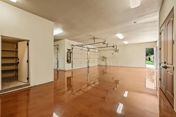 a living room with lots of furniture and a large window