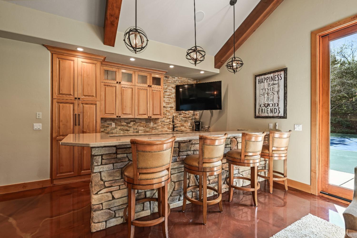 5687 Ridge Park Drive Loomis, CA 95650 - Photo 50 of 79 a kitchen with a table and chairs in it