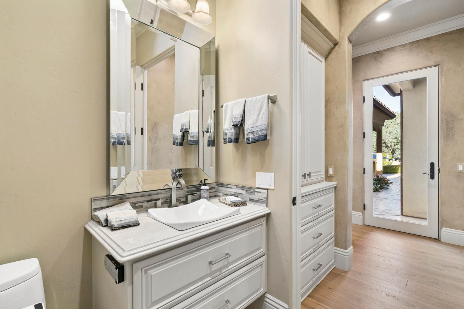 5687 Ridge Park Drive Loomis, CA 95650 - Photo 66 of 97 a bathroom with a sink vanity granite and a mirror