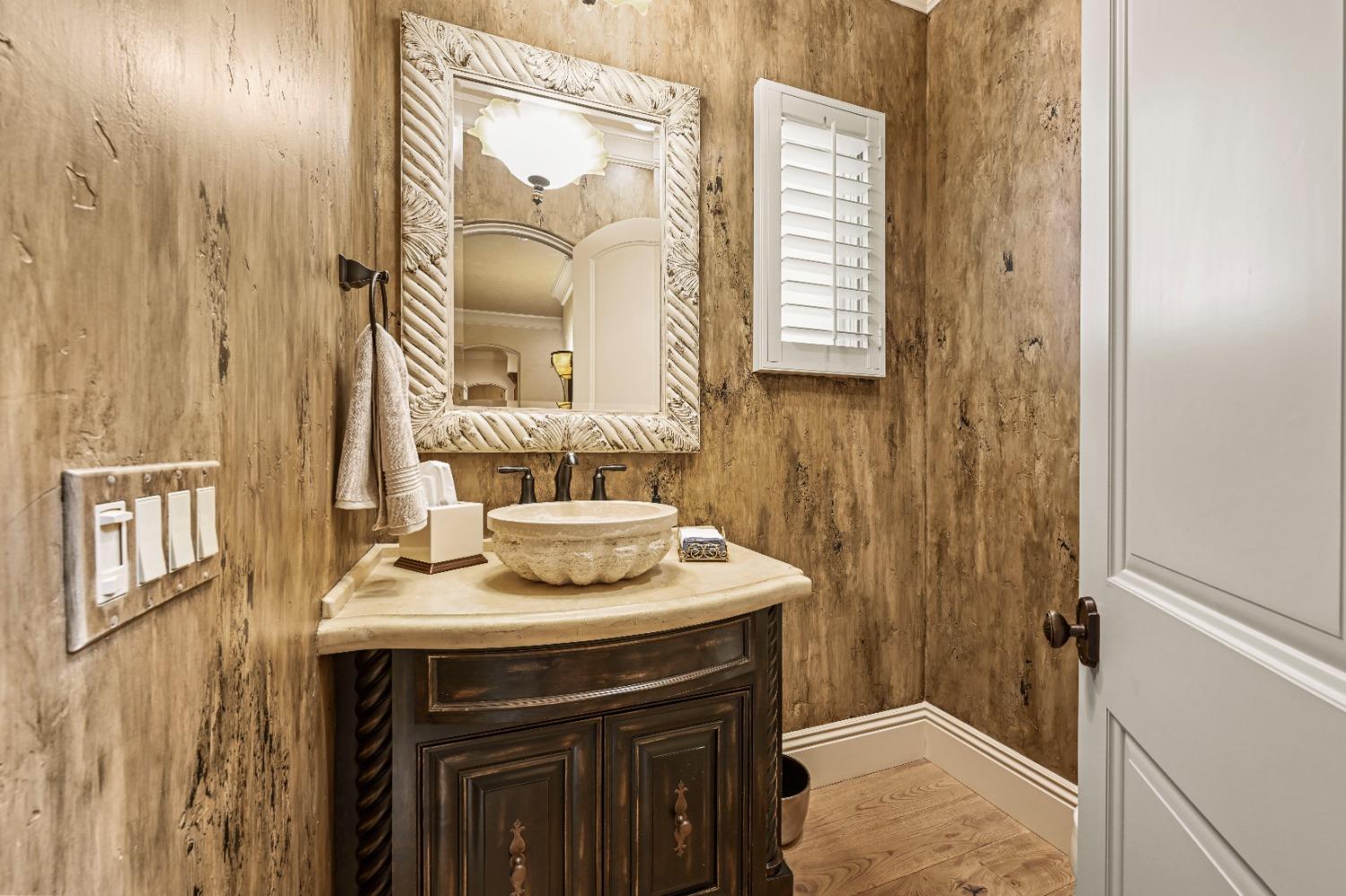 5687 Ridge Park Drive Loomis, CA 95650 - Photo 78 of 79 a bathroom with a sink and a mirror