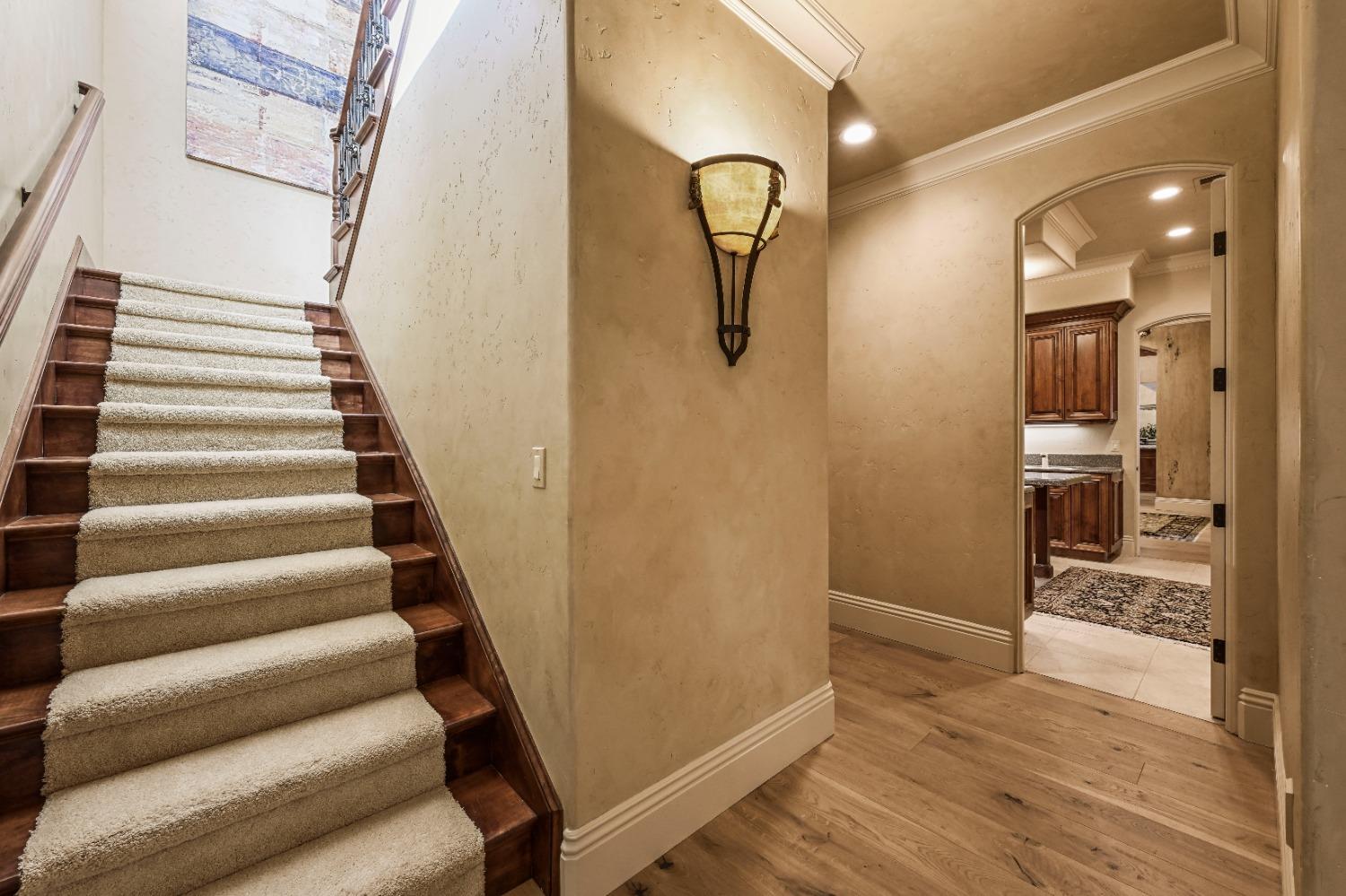 5687 Ridge Park Drive Loomis, CA 95650 - Photo 79 of 79 a view of a hallway with wooden floor and staircase