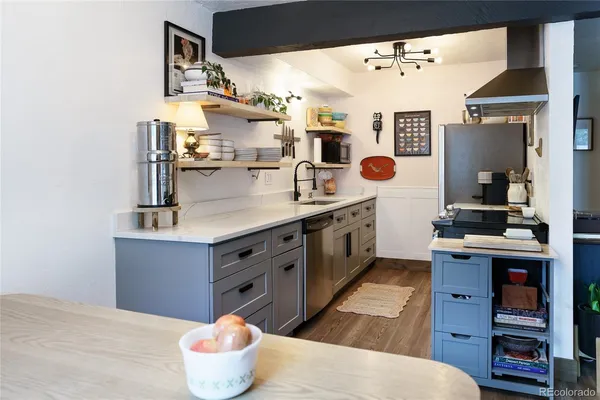 a kitchen with a sink and a stove