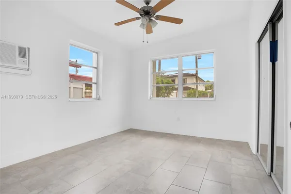 a view of an empty room with a window