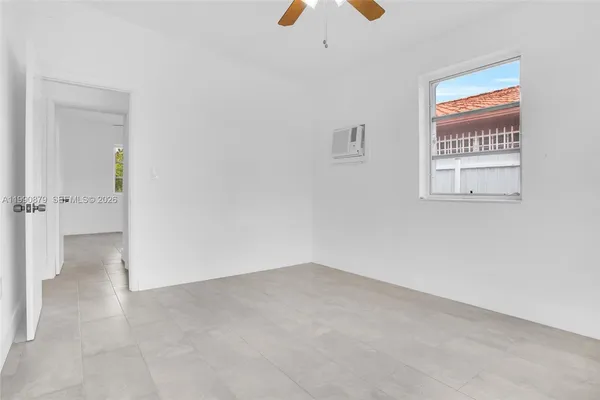 an empty room with windows