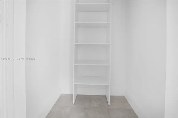 a view of an empty walk in closet