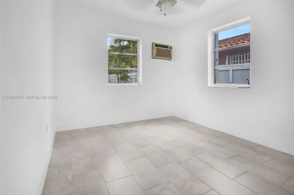 an empty room with windows
