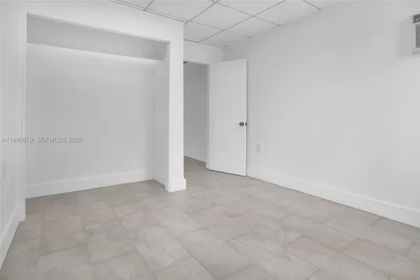 a bathroom with a toilet and a bathtub