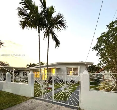 a front view of a house with outdoor seating