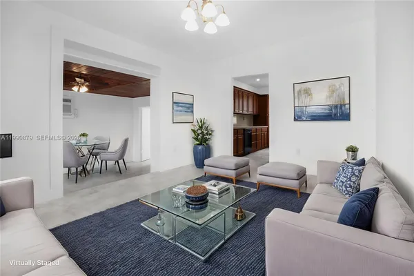 a living room with furniture and a rug