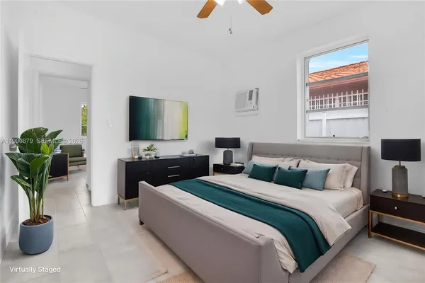 a bedroom with a bed and a book shelf