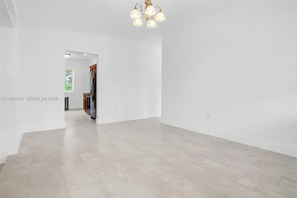 a view of a hallway with a chandelier
