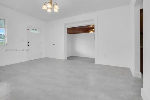 a view of an empty room with a window