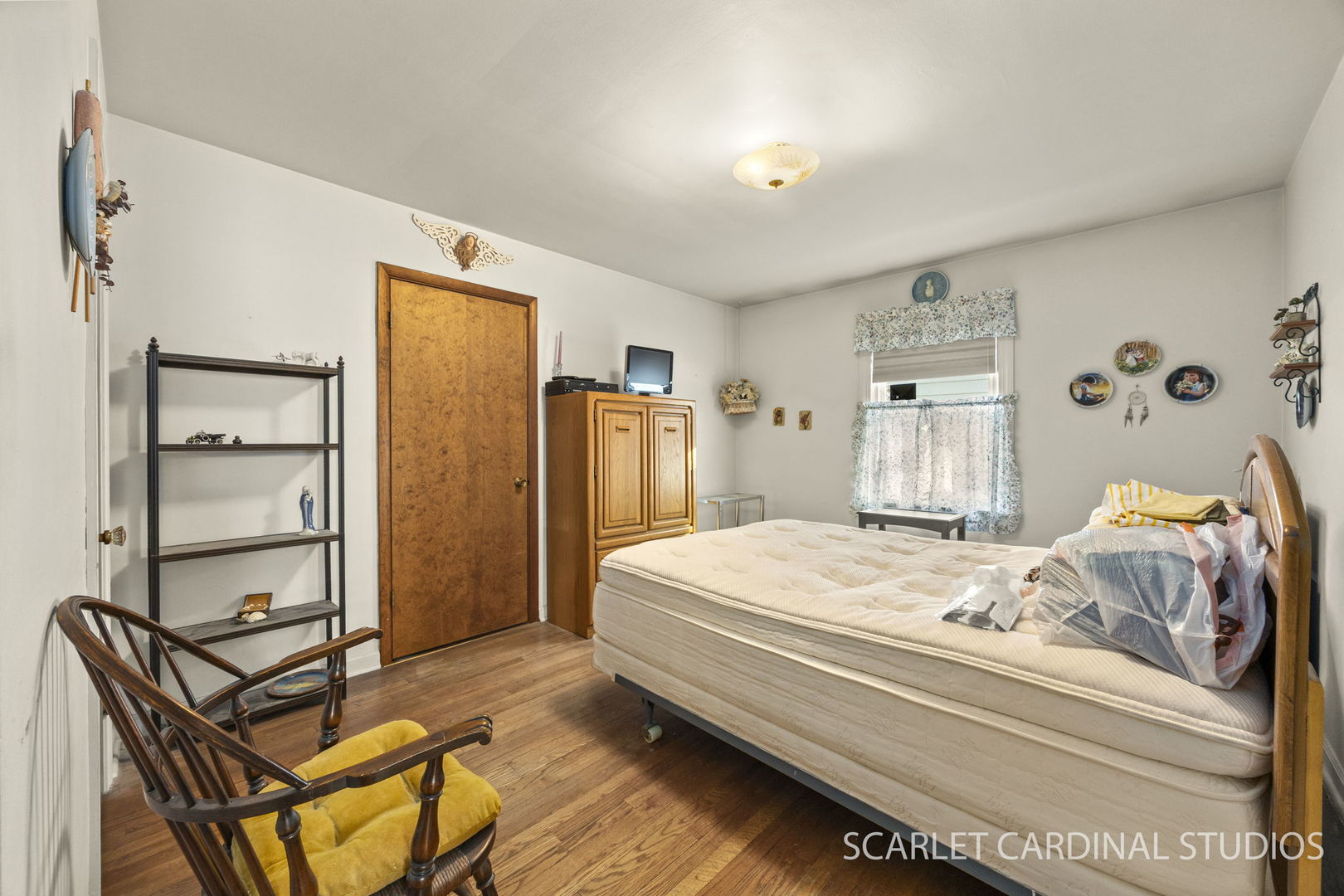 543 South Chase Avenue Lombard, IL 60148 - Photo 9 of 16 a bedroom with a bed and a refrigerator