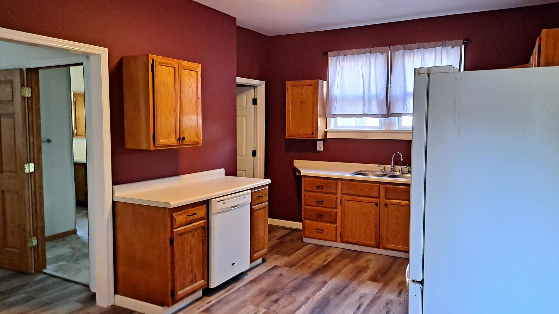 206 West Minnesota Street Spring Valley, IL 61362 - Photo 7 of 33 a kitchen with stainless steel appliances a stove and a refrigerator