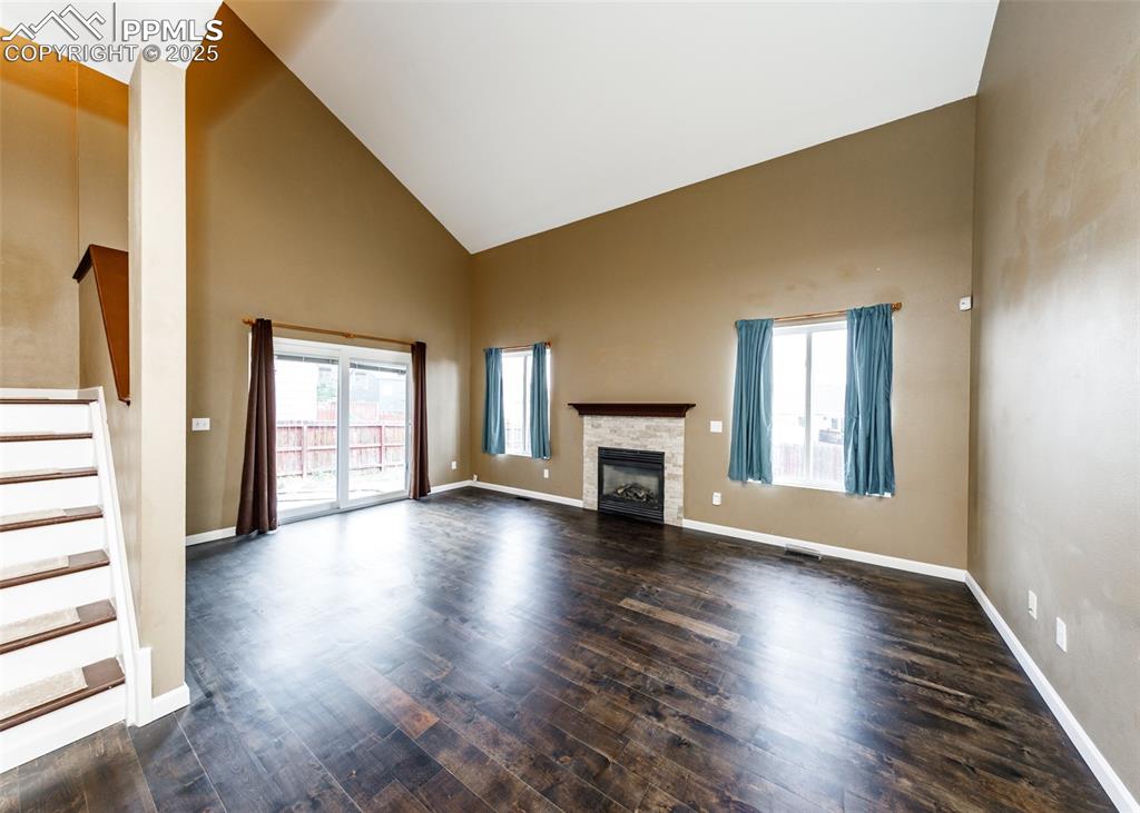 8119 Oliver Road Peyton, CO 80831 - Photo 11 of 38 a view of an empty room with wooden floor and a window
