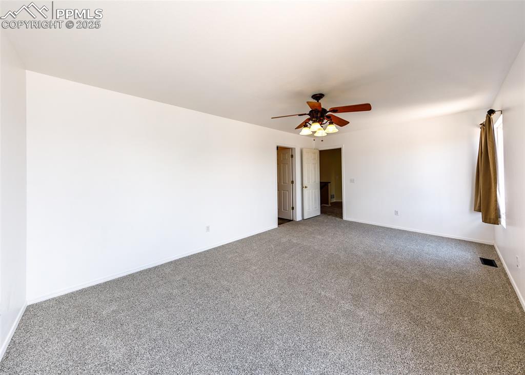 8119 Oliver Road Peyton, CO 80831 - Photo 18 of 38 a view of a room with a ceiling fan