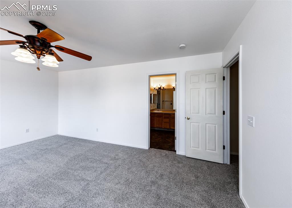 8119 Oliver Road Peyton, CO 80831 - Photo 19 of 38 a view of a livingroom with a ceiling fan and window