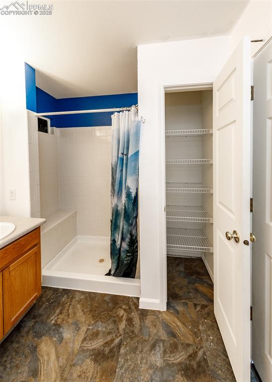 8119 Oliver Road Peyton, CO 80831 - Photo 22 of 38 a bathroom with a bathtub and shower