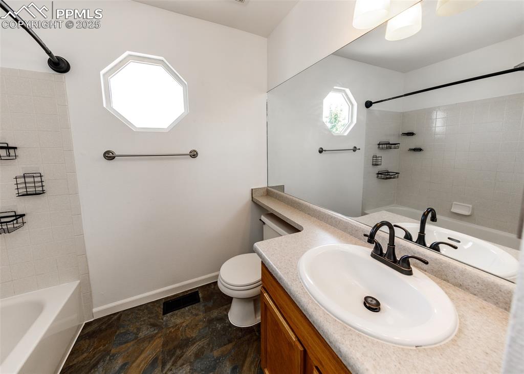 8119 Oliver Road Peyton, CO 80831 - Photo 26 of 38 a bathroom with a sink and a mirror