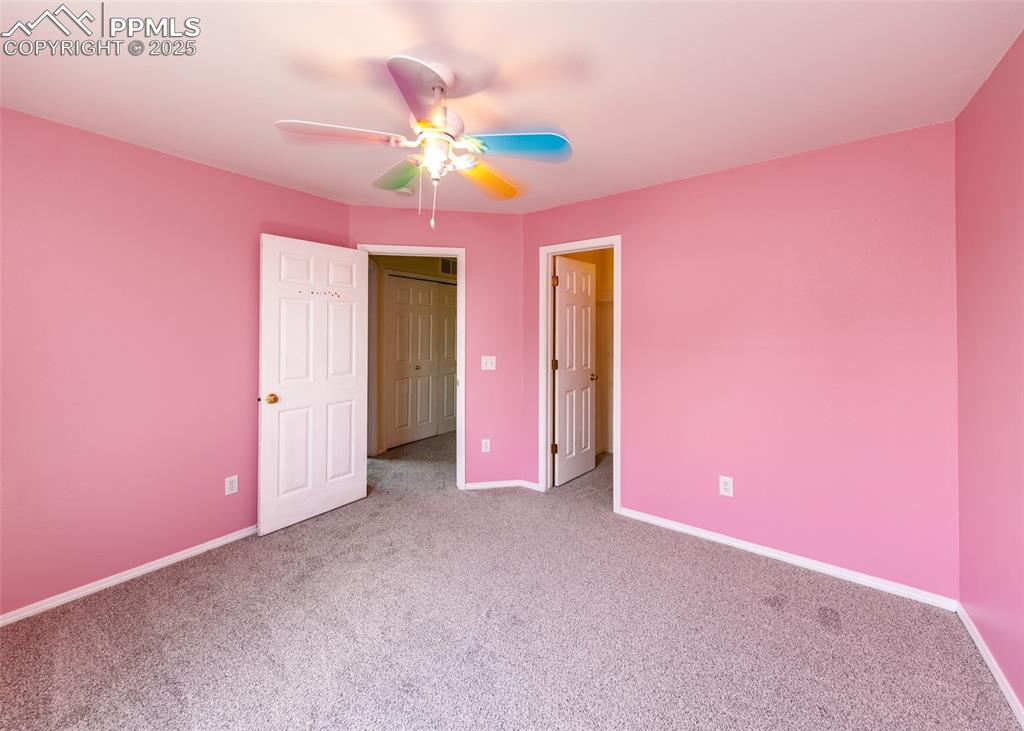 8119 Oliver Road Peyton, CO 80831 - Photo 29 of 38 a view of a livingroom with a chandelier fan