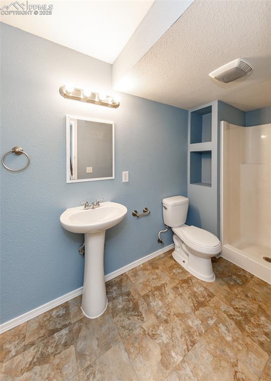 8119 Oliver Road Peyton, CO 80831 - Photo 33 of 38 a bathroom with a sink toilet