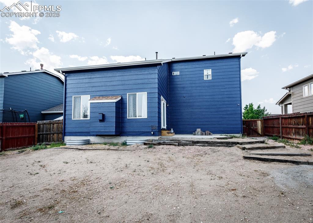 8119 Oliver Road Peyton, CO 80831 - Photo 38 of 38 a view of a house with a yard