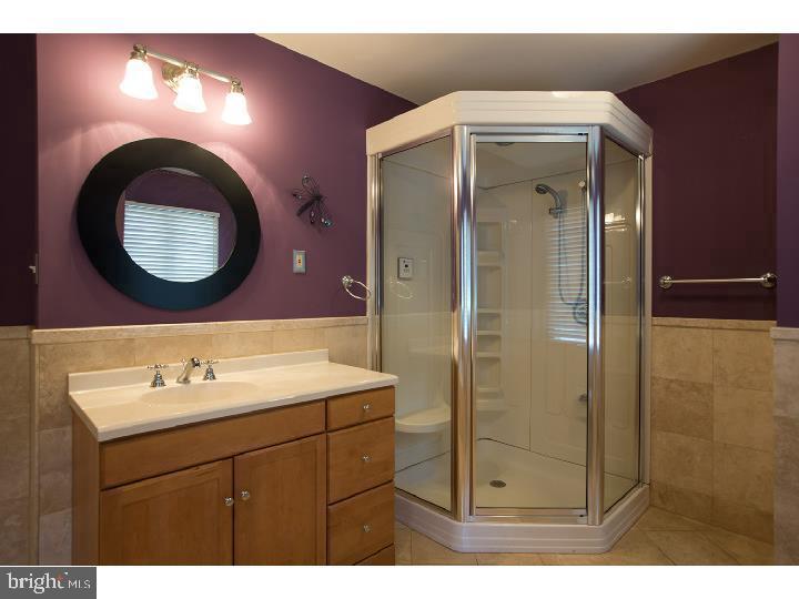 35 Beulah Road Doylestown, PA 18901 - Photo 15 of 41 a bathroom with a sink mirror and vanity